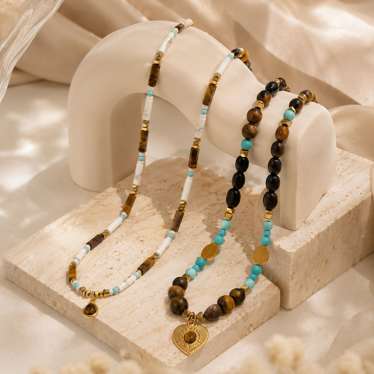 Healing crystal necklace styled in a soft boho setting with natural stones and layered design