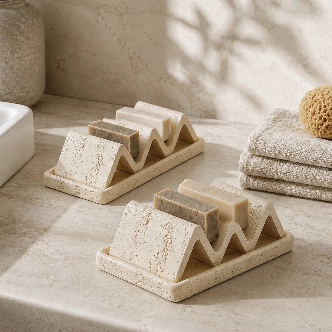 Double-sided natural stone soap dish with beige and white soap holders in spa bathroom