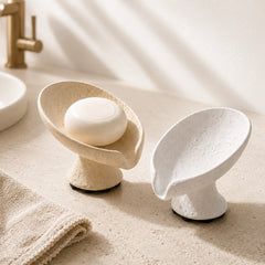 Wabi Sabi elevated soap dish with beige and white color options on a calm bathroom countertop.
